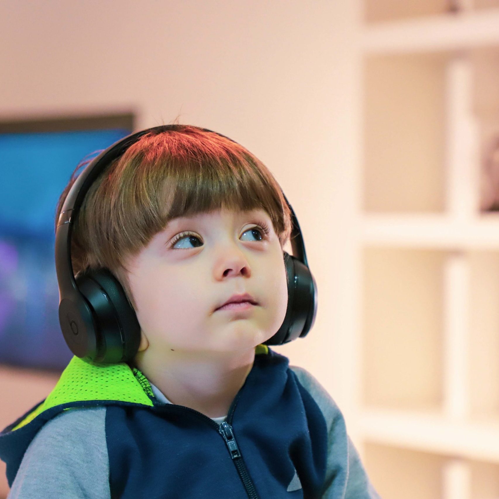Child with assistive technology headphones.